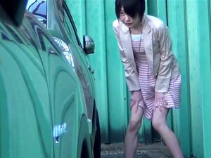 Asian girl pisses outside and fingers